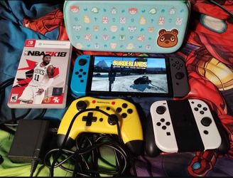 Nintendo switch oled with two games, $180