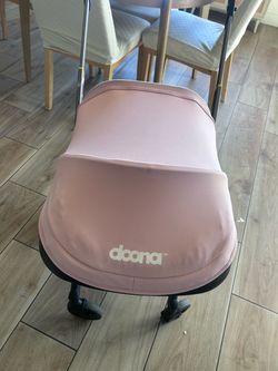Doona car seat and base . pink