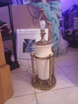 mid-20th century French opaline and gilt-bronze urn-style lamps. It features a white opaline glass urn set within a structured brass base.Similar vint