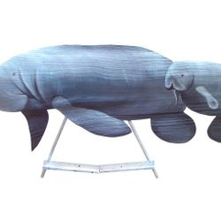 Mother Manatee and baby hand carved from palm tree frond