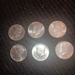 Six Kennedy Half Dollars. 