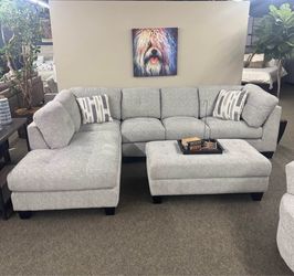 Pottery Barn gray chenille sectional couch and ottoman