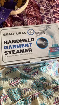 Hand held garment steamer