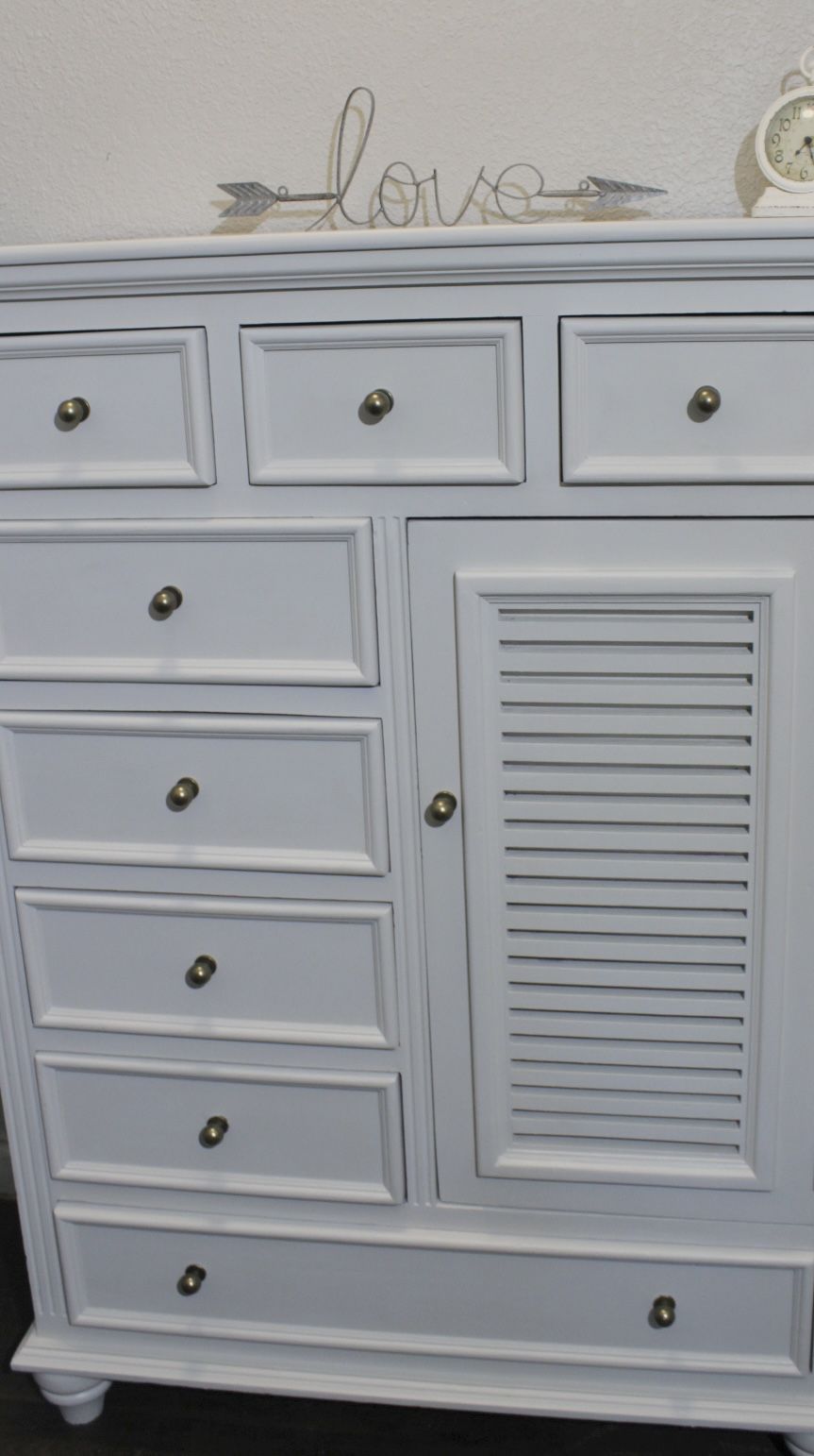 An Off White Tall Chest Of Drawers