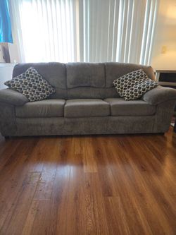 Brown sofa & loveseat + slip covers
