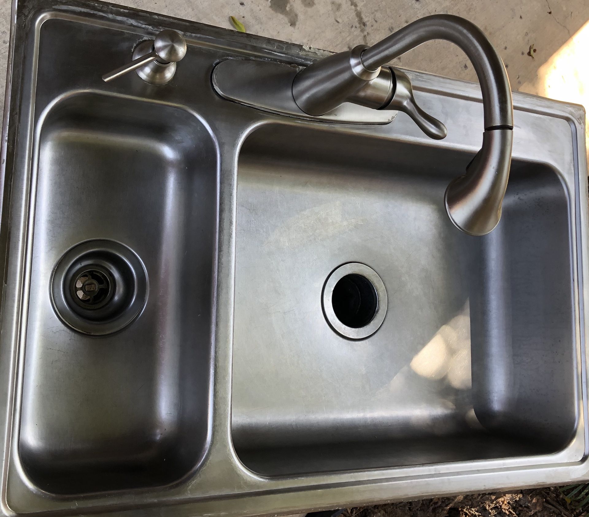 Double sink moen faucet and garbage disposal