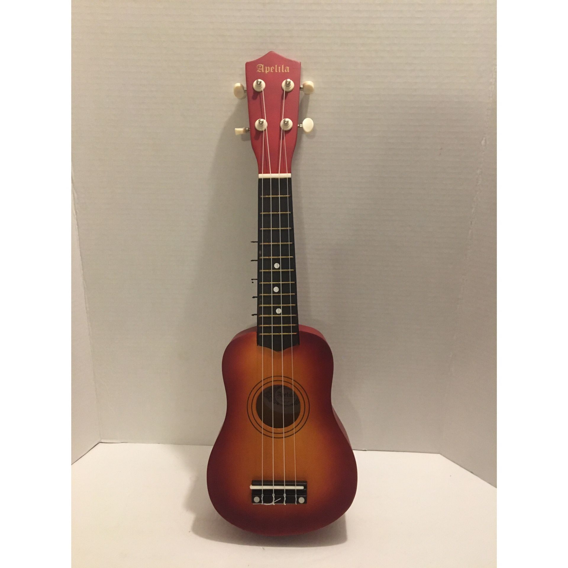 Apelila Brown 4 String Ukulele With Bag