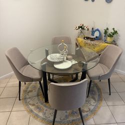 Glass Dining Table With A Rug