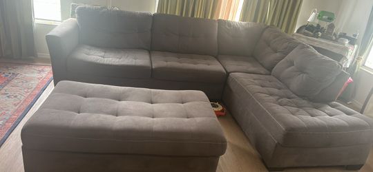 Grey couch with ottoman
