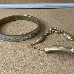 Two bracelets lot silver and gold tones goes with everything. Bracelet market with b and has a heart clasp. Brighton???  The back on the metal that to