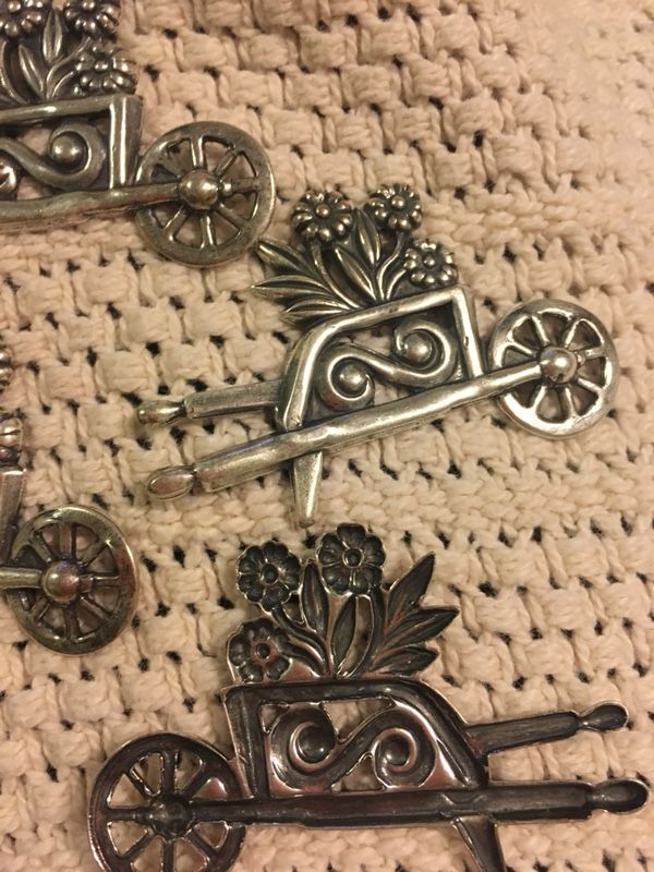 Metal wheelbarrow with flowers , arts and craft , pins , put on the fridge with a magnet . $2.50each . Great for Mother’s Day
