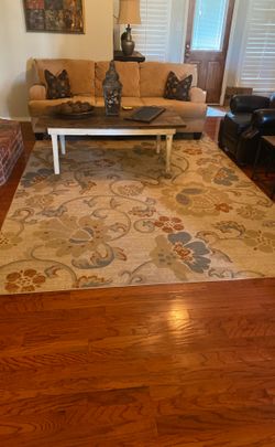8 by 11 floral area rug, in good condition. 75.00