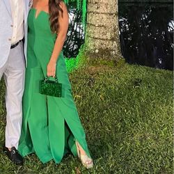 Green romper with pockets. Size M