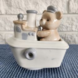 ArtMark Porcelain Music Box a teddy bear in a tugboat. 
