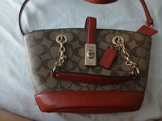 Brown coach bag with detachable strap