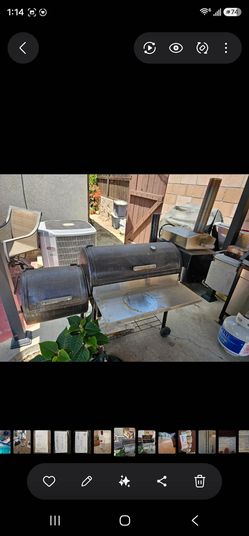 Smoker with pizza oven attached to it.