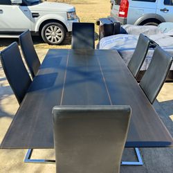 Brown &Black glass top Dining room table with 6 black faux leather chairs