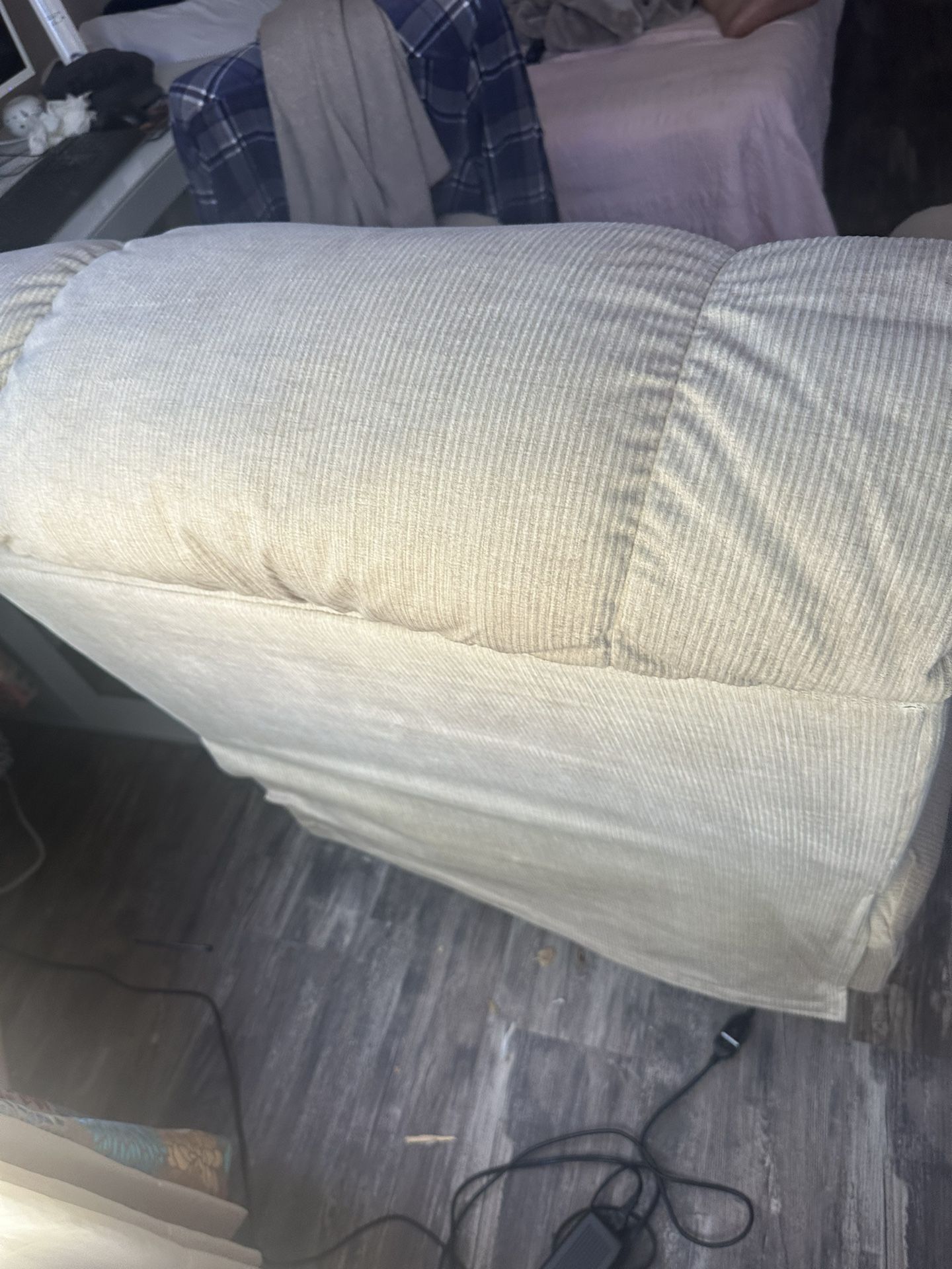 A La-Z-Boy Recliner With The Remote For Your Head Legs. It Lifts If Somebody Has Problems Getting Up.