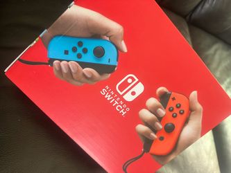 Nintendo switch  with neon red and neon blue joy cons