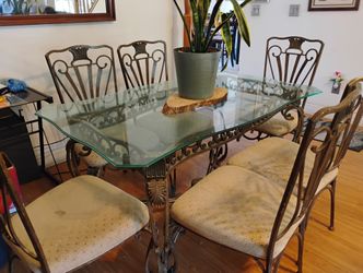 Glass dining room table with six chairs