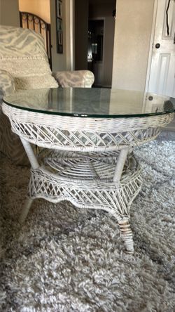 Small wicker table with glass top