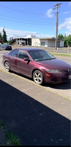Mazda six sedan burgundy, tender windows