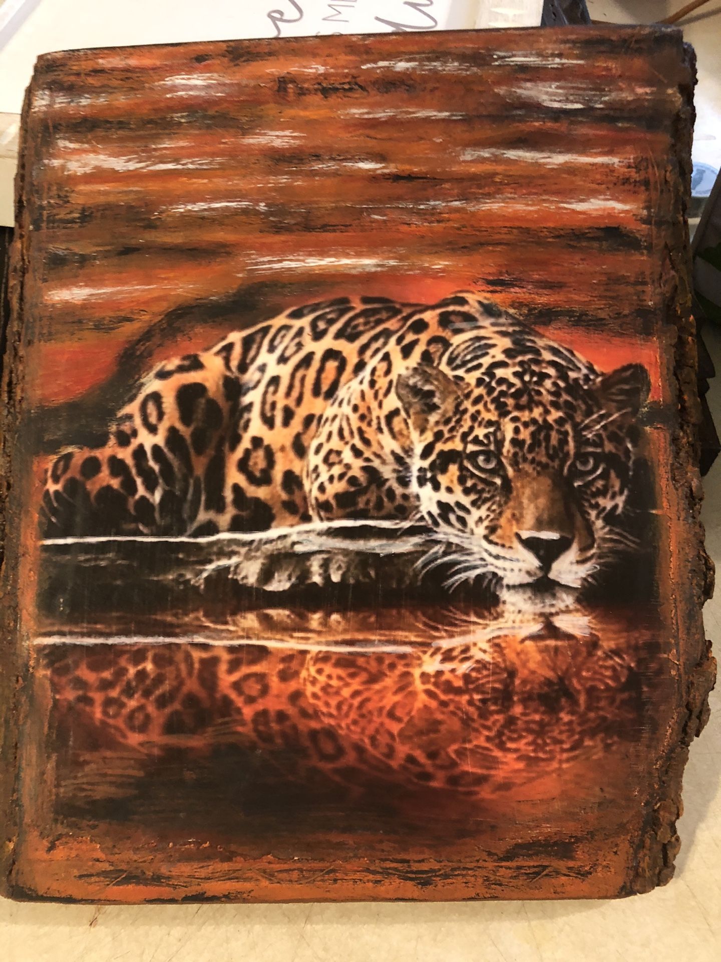 Transfer print of leopard onto a wooden park board