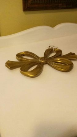 Vintage solid brass bow trivet.