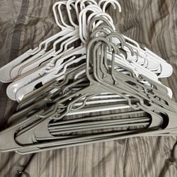 Bunch Of White & Grey Plastic Hangers 