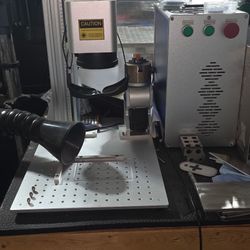 Used low hour 60 watt fiber laser with turret. F254 (175x175) and F290 (220x220) lens.