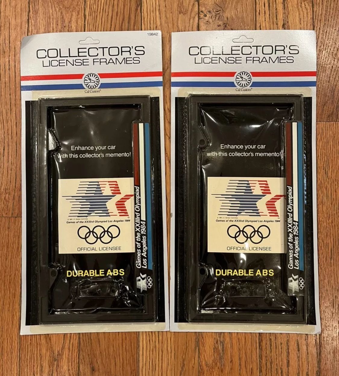 New Vintage Pair 1984 Olympic Games Los Angeles Car License Plate Frame Holder