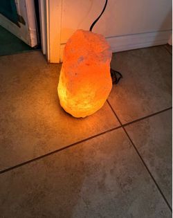 Himalayan salt lamp Roughly 10 inches and 20 pounds