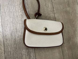 Dooney & Bourke creamy white leather snap wristlet with a strap. 