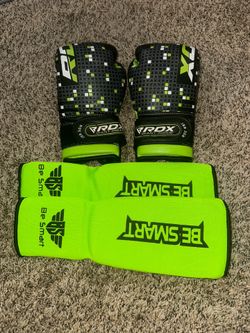 Kids boxing gloves and shin guards