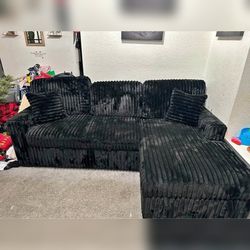 Black pull out sectional sofa