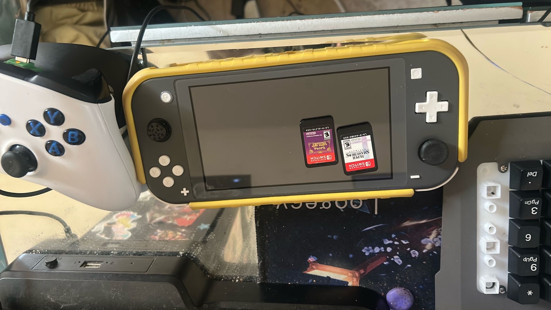 A Switch Lite That Comes With Game And A Switch Oled That Comes With Games Too 