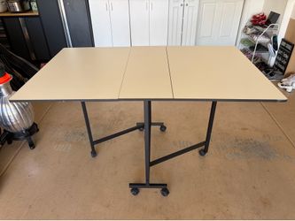 Folding table with wheels