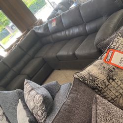 Sectional for 1299 in brown cloth like leather