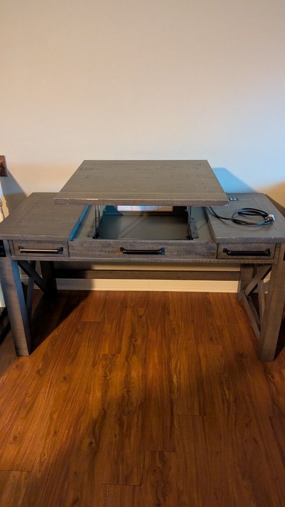 Grey desk with standing desk conversion section