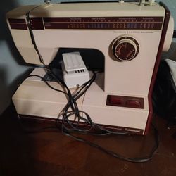 Montgomery Ward sewing machine, specifically model UHT J1954, which is a collectible item. 
