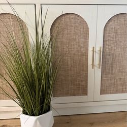 Faux plant with white geometric vase