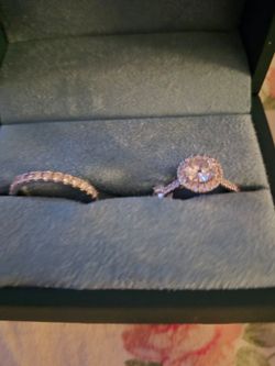 Almost new purchased in December  1 and 1/2 carat halo engagement ring and matching 1/2 stone shaped ring. Size 8. All original paper work from kays j