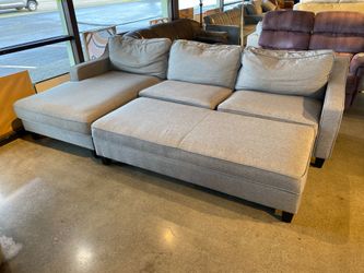 Light Grey Upholstered Sofa with Chaise and Large Storage Ottoman