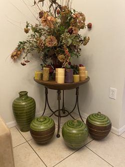 Round table vases candles and ornaments