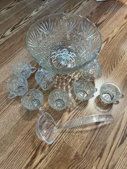 Cut glass punch bowl with 8 cups and hooks and plastic ladle