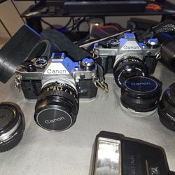 Sale This Weekend Only. Must Sell. Canon AE-1 × 2,  Photo Enlargers, Lenses, Plus Extras. 