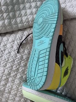 This is a Nike Air Jordan 1 Mid SE GS "Aurora Green" 