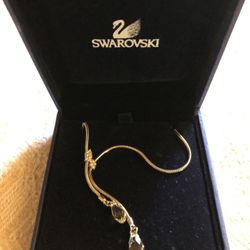 Swarovski crystal necklace in original box. Base chain is approx 14.5 inches. Extension adds another 2.5 inches. The longer