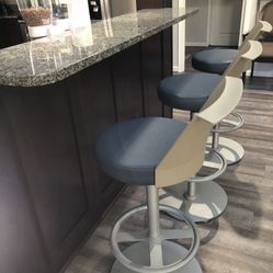 3 luxury vinyl swivel bar height chairs