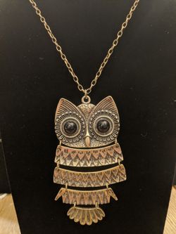 $10. Articulated goldtone brass tone Owl necklace with black eyes. Necklace is 32-in. Pendant is 4-in long and 2-in wide.